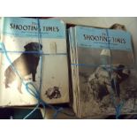 Two boxes containing an extremely large selection of various vintage Shooting Times magazines mostly