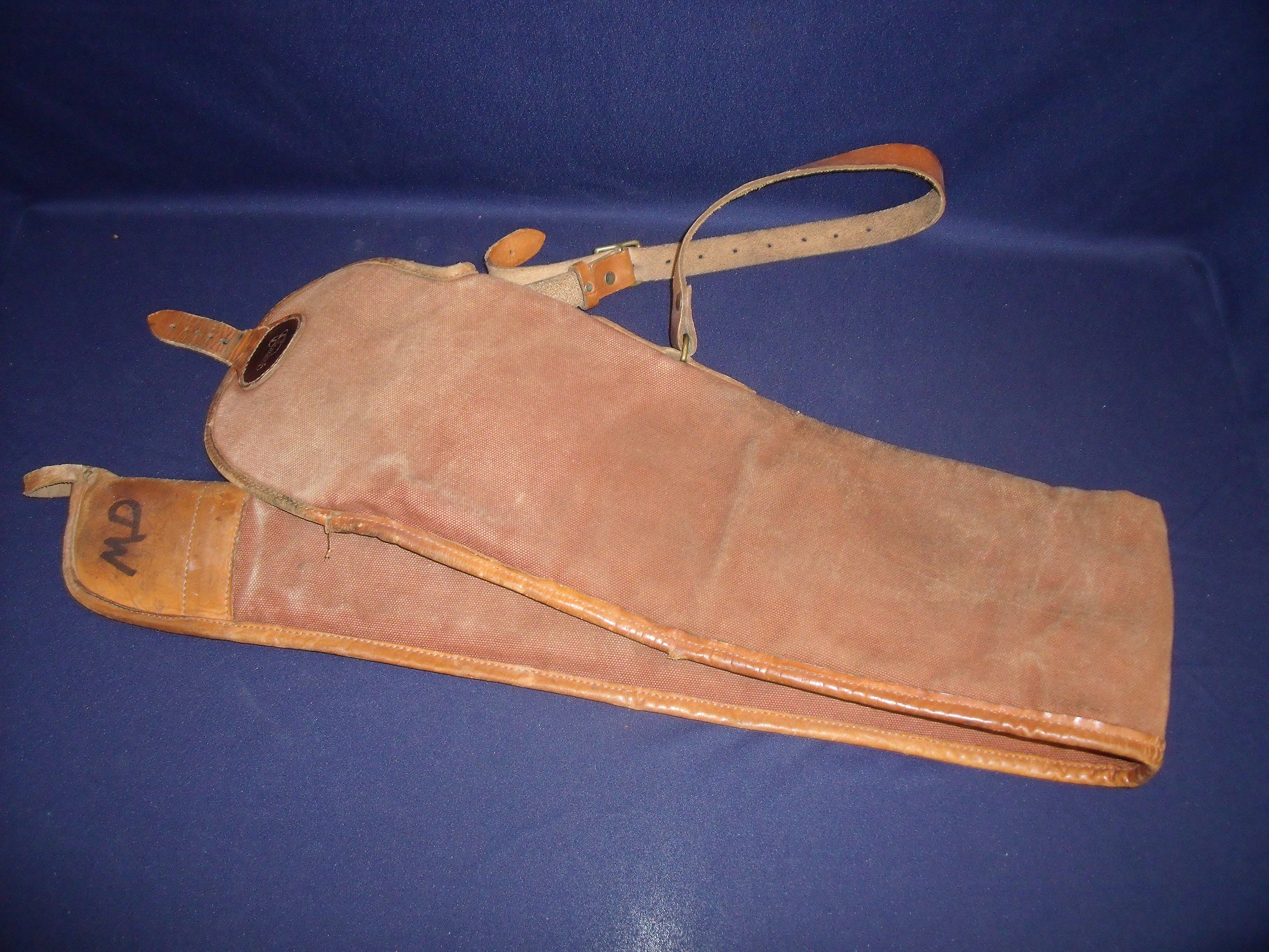 Gunmark canvas and leather bound gun slip with leather shoulder strap and wool lining