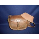 Brady tan leather cartridge bag, the back stamped Warranted Cow Hide Payne Galwey, with leather