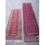 Red & blue ground Persian style runner rug (266cm c 60cm) and another runner (2)