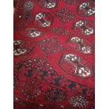 Small red ground Persian style rug (82cm x 120cm)