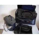 Black leather pilot style travel case and a selection of various assorted luggage, ladies