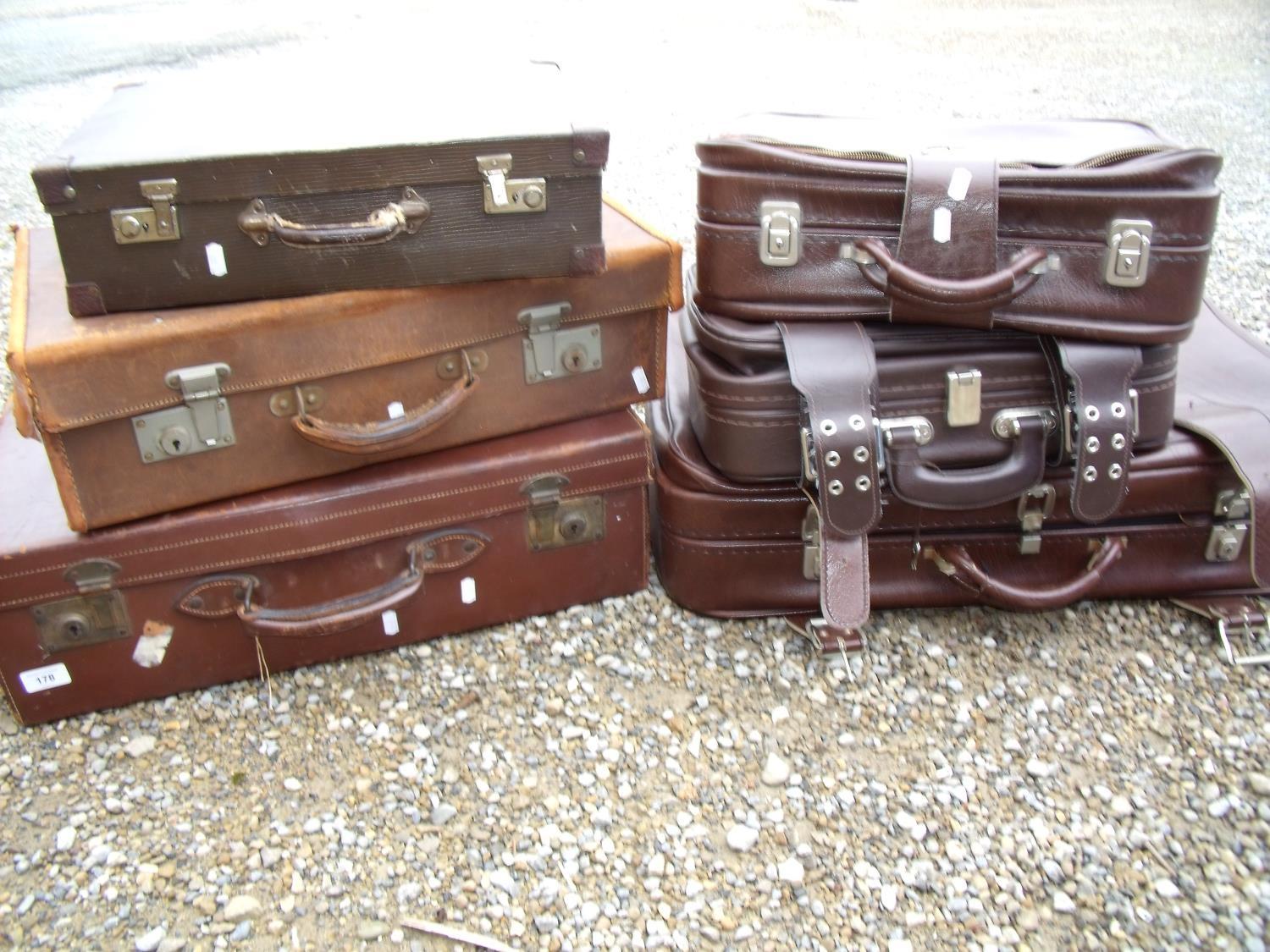 Vintage brown leather suitcase, another similar and a small selection of other later luggage