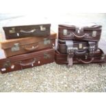 Vintage brown leather suitcase, another similar and a small selection of other later luggage