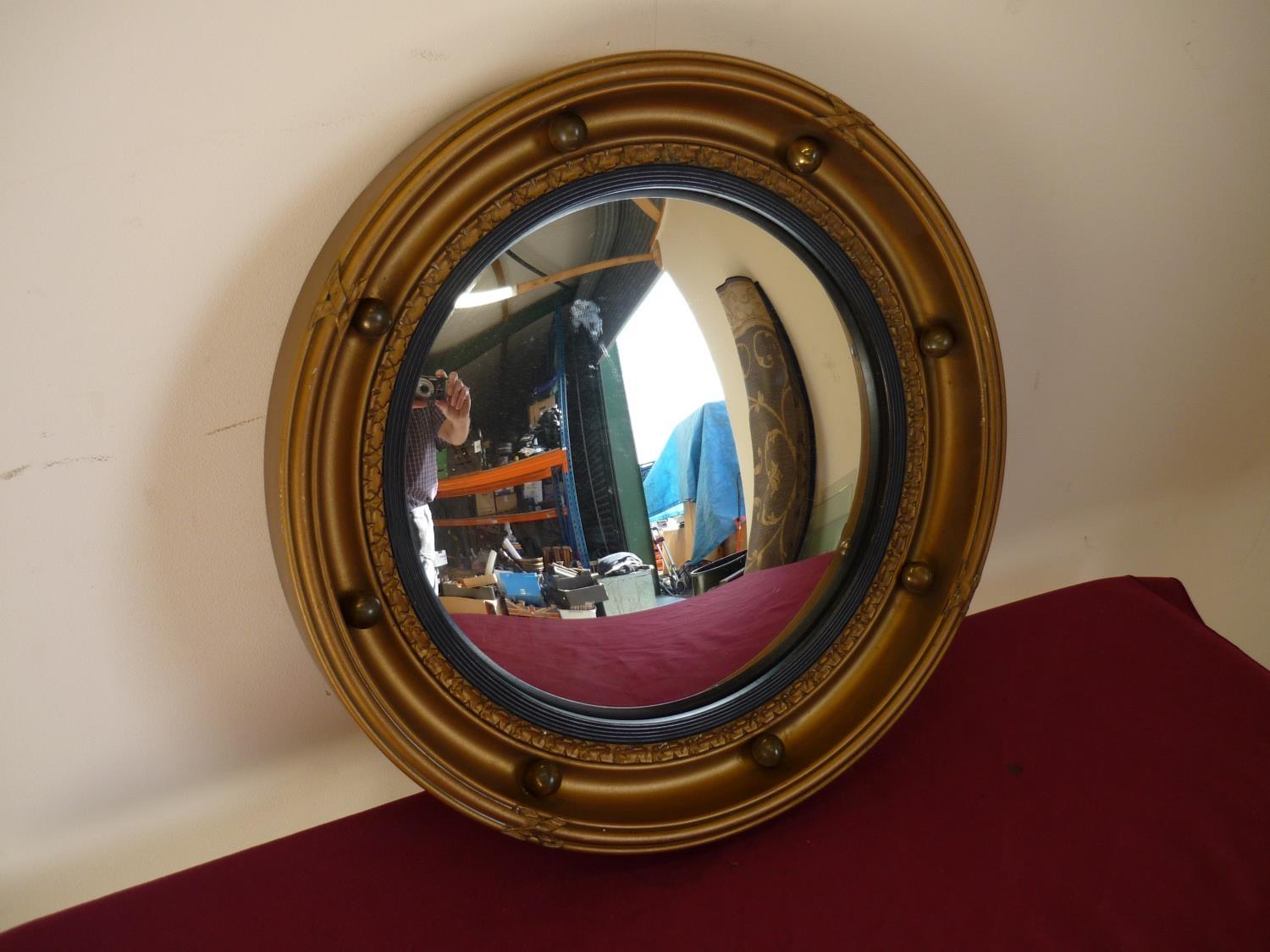 Gilt framed 19th C style convex wall mirror (diameter 42cm)