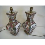 Pair of oriental ceramic table lamps of square bulbous form on raised bases (height 40cm)