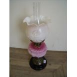 Victorian oil lamp with opaque glass shade and coloured glass reservoir on turned base (58cm high)