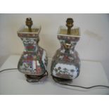 Pair of oriental ceramic table lamps of square bulbous form on raised bases (height 40cm)