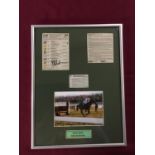 Framed montage of newspaper cuttings and a photo of Rebel Rock signed by the jockey Peter