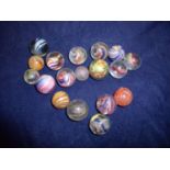Group of various early swirl pattern marbles