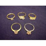 Group of five dress rings, four in 9ct yellow gold set with CZ stones and one 9ct white gold