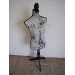 Modern tailors dummy female mannequin on ebonised frame, upholstered in French style fabric (