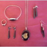 Collection of Whitby Jet jewellery including earrings, silver mounted bracelet, signet style ring