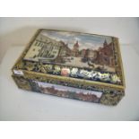 Large embossed E. Otto Schmidt tin with hinged top depicting various town scape scenes (42cm x