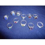 Group of eleven silver dress rings set with various coloured stones, marquisette etc