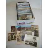 Box containing a selection of various assorted world postcards including black & white, coloured etc