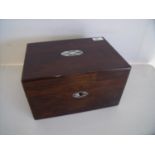 Rosewood and Mother of Pearl inlaid dressing table box, the hinged lid revealing fitted interior