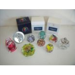 Small selection of various glass paperweights including millefiori, a brass table lighter and