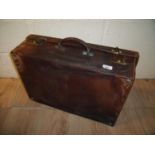 Leather vintage suitcase with twin brass locks