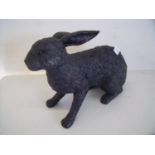 Composite figure of a seated rabbit