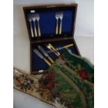 Mahogany fish knife and fork case with a small selection of contents, a Victorian wool work