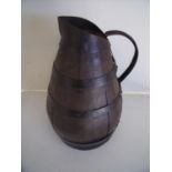 Large iron coopered oak jug of tapering form with loop handle (48cm high)