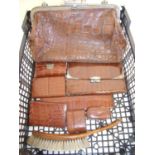 Selection of 19th/20th C crocodile skin bags, travelling items, purses etc including silver mounted