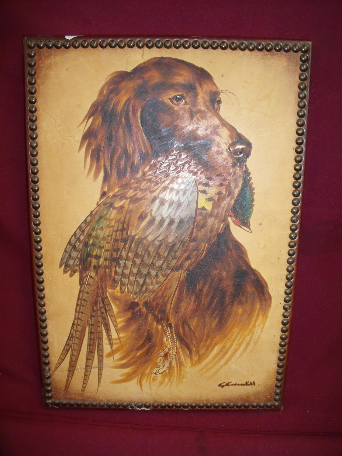 Painted and tooled leather wall panel depicting spaniel and pheasant (35cm x 50cm)