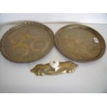 Two eastern brass trays and a 19th C brass and porcelain handle