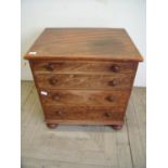 Victorian pine commode in the form of a four drawer chest on turned supports (64cm x 48cm x 71cm)