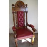 Extremely large and elaborate carved oak throne style chair with upholstered seat, back and arms,