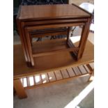 Retro teak rectangular coffee table and a similar next of three occasional tables