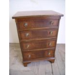 Quality reproduction mahogany dwarf chest of four drawers on raised bracket feet (51cm x 37cm x