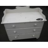 Painted Victorian pine chest with raised back and sides above three drawers on bun feet (111cm x