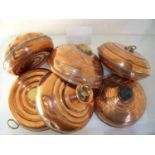 Six copper hot water bottles/pans