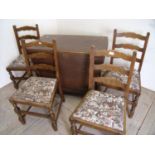 Oak drop leaf gate leg table on turned supports and a set of four ladder back chairs with drop-in