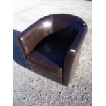 Tub chair in brown leather