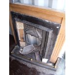 Light oak fire surround with cast metal Victorian style insert with a selection of tiles