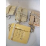 Four vintage retro telephone in various style and colours