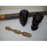 Two carved hard wood African style bust figures, a didgeridoo and a carved African style salad