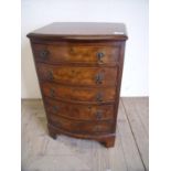 Reproduction walnut bow front dwarf chest of five drawers on raised bracket supports (46cm x 36cm