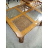 Hardwood coffee table with four panelled Bergere top