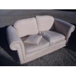 Two seat settee in cream pattern upholstery