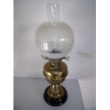 Early 20th brass oil lamp on turned base with etched glass shade