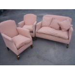 Early 20th C three piece suite comprising of two seat settee and a pair of matching armchairs