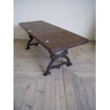 Hardwood coffee table with cast iron ornate legs