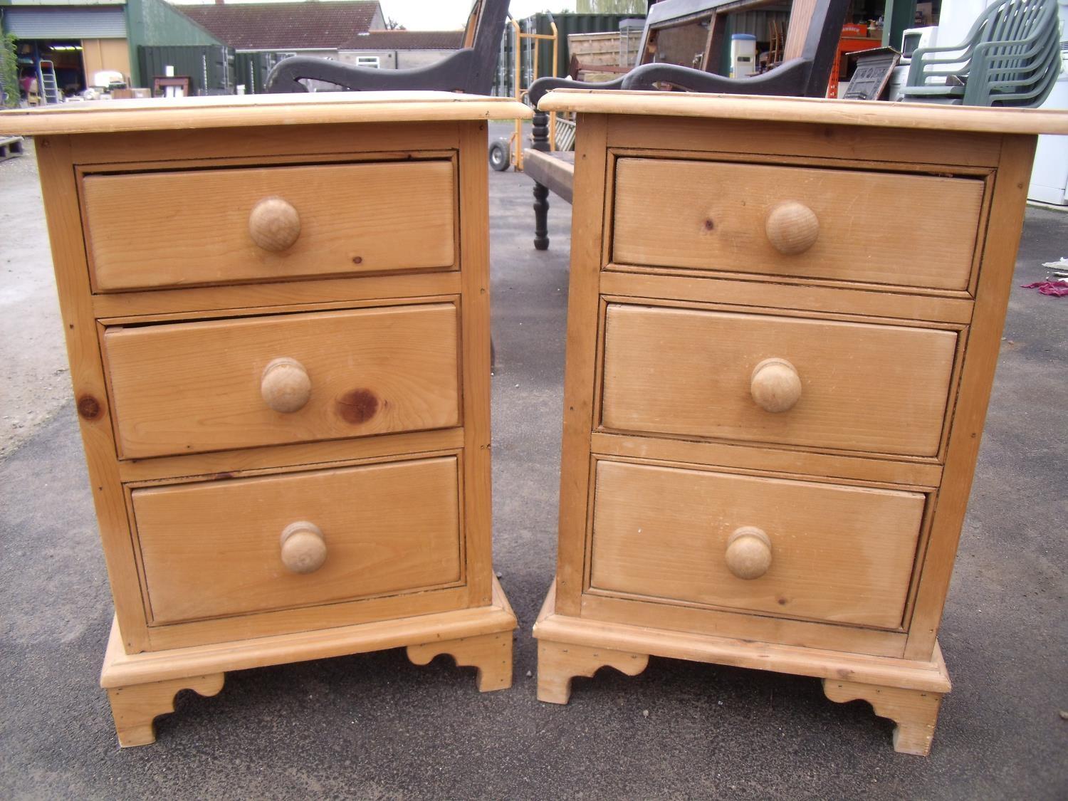 Pair of waxed pine three drawer bedside chests (47cm x 34cm x 66cm)