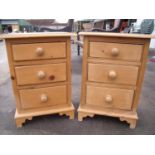 Pair of waxed pine three drawer bedside chests (47cm x 34cm x 66cm)