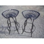 Pair of metal tractor seat style bar stools