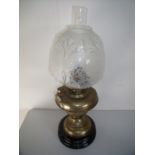 Late Victorian brass oil lamp on turned circular ceramic base with etched and moulded glass shade (